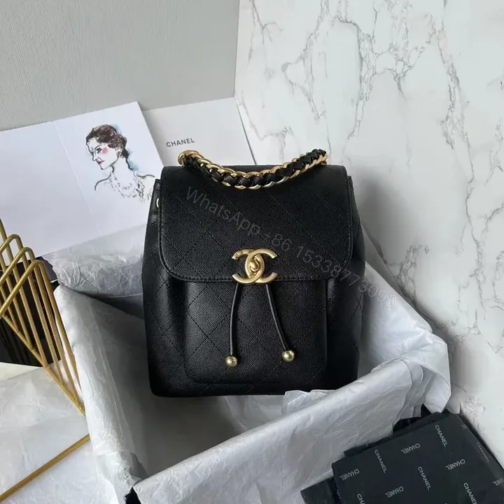 View 1 of Chanel-Inspired Quilted Leather Backpack with Gold Hardware
