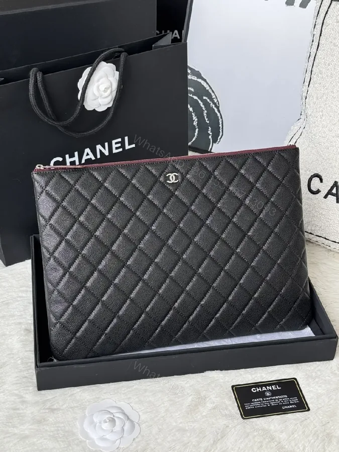 View 1 of Compact Black Quilted Leather Clutch with Silver Logo