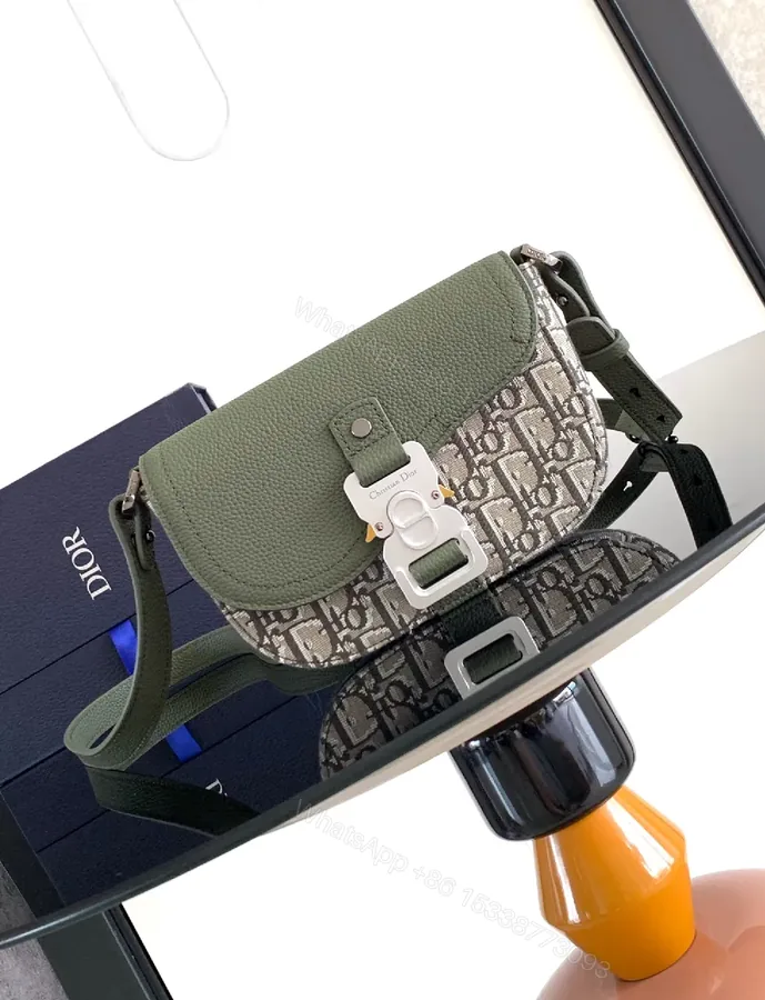 View 1 of Olive Pebbled Leather Crossbody with Monogram Accent