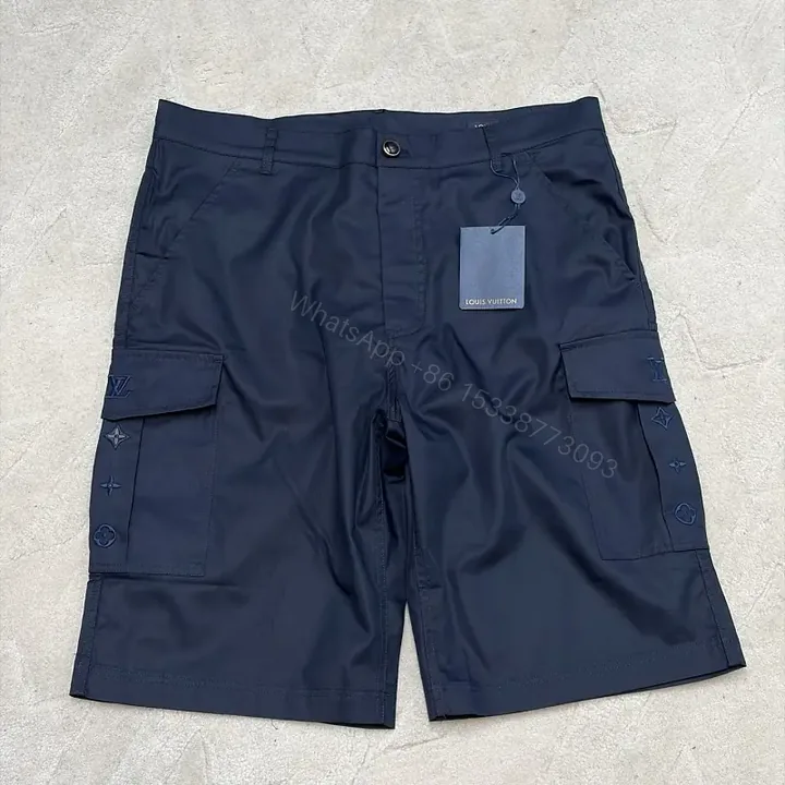 View 1 of Navy Cargo Shorts with Louis Vuitton Logo Embossed Key Features Short