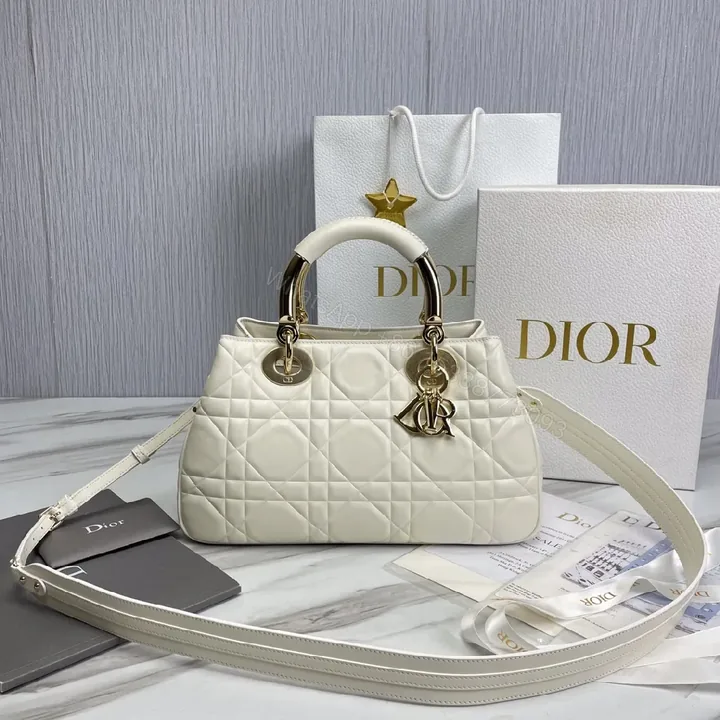 View 1 of Ivory Faux Leather Quilted Satchel with Signature Charms