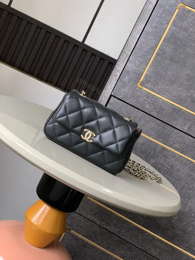 View 1 of Quilted Black Faux Leather Bag with Gold-Close Compact Evening Bag
