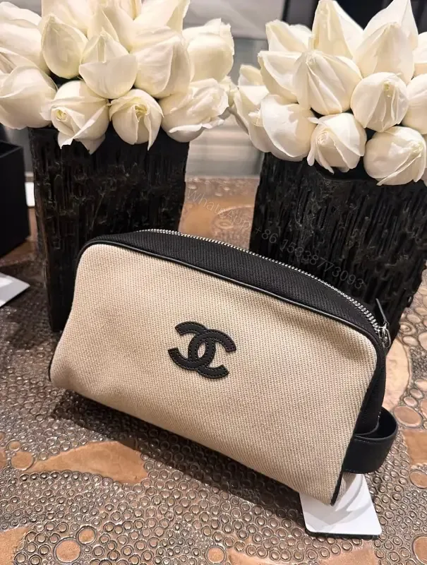View 1 of Beige Canvas Pouch - Black Trim, Logo, Wrist Strap, Compact