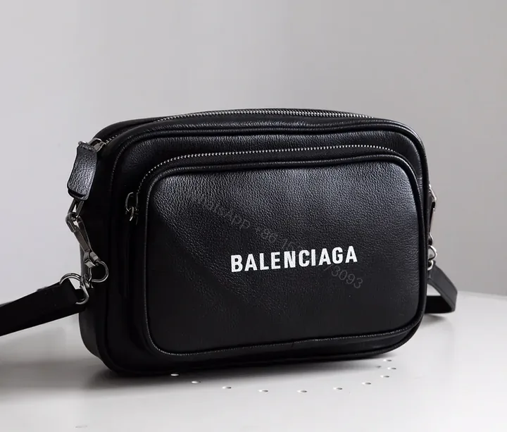 View 1 of Compact Black Leather Crossbody: Bold Logo, Versatile Style