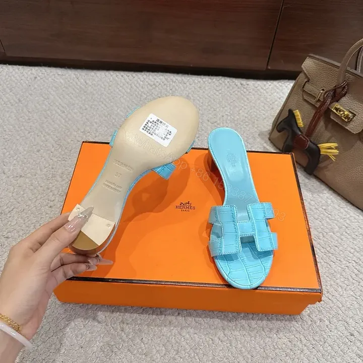 View 1 of Bright Sky Blue Leather Mules with Croc-Texture Strap - Luxury Comfort