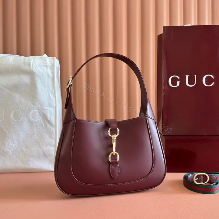View 1 of JACKIE SMALL SHOULDER BAG 27 IN BURGUNDY RED CALFSKIN GOLD HARDWARE