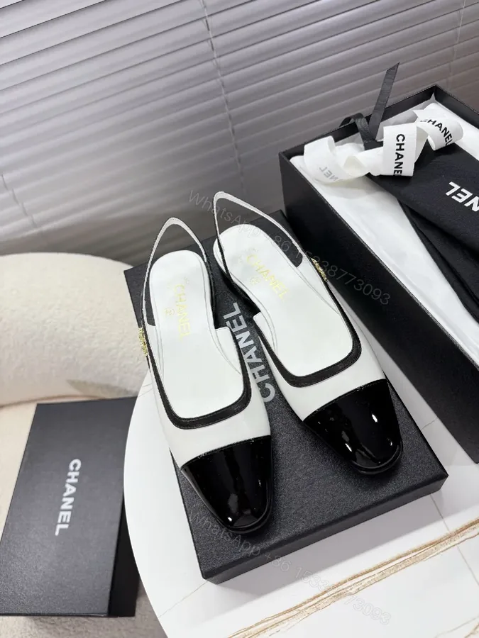 View 1 of Two-Tone Patent Slingback Pumps: Sharp Architectural Elegance