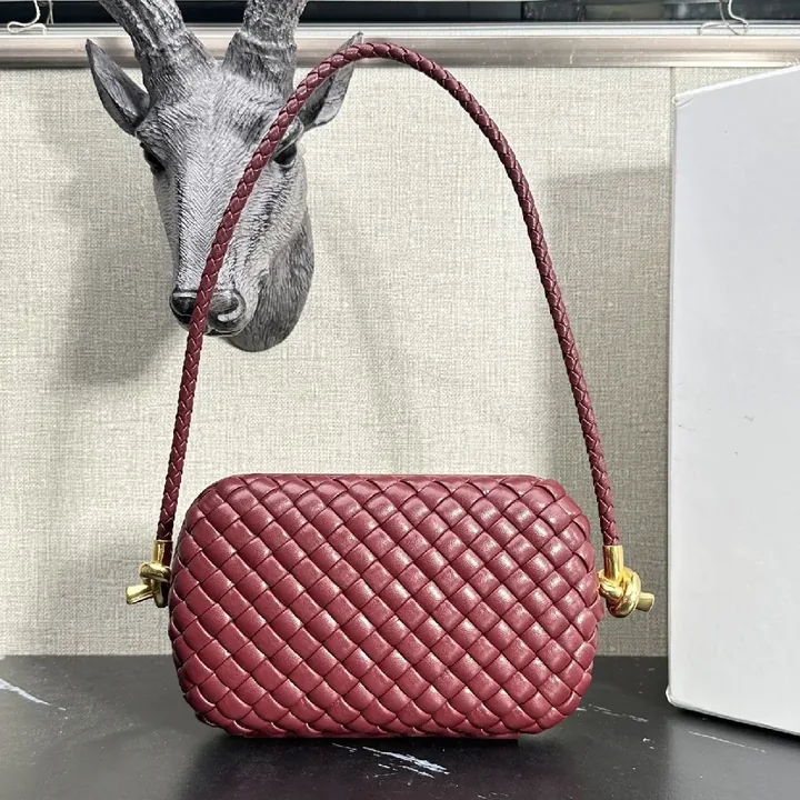 View 1 of Richly Textured Burgundy Crossbody Bag – Woven Leather, Compact Style
