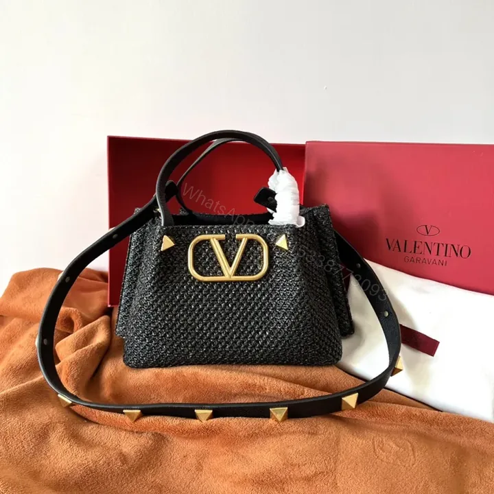 View 1 of Black Woven Luxe Handbag: Compact, Gold-Accent Style Bag