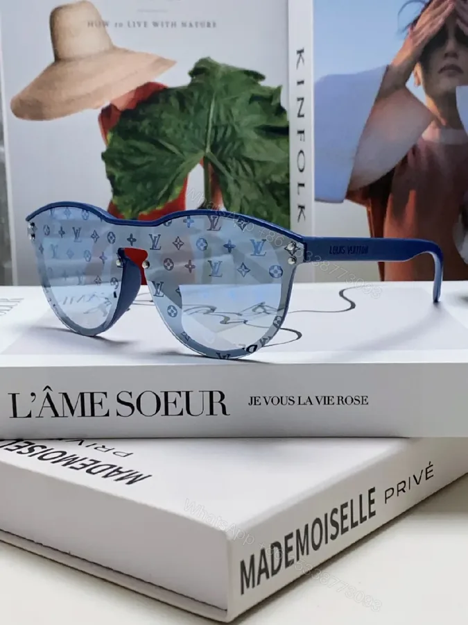 View 1 of Blue Translucent Monogram Shield Sunglasses - Oversized, UV-safe, Light-Weight Acetate