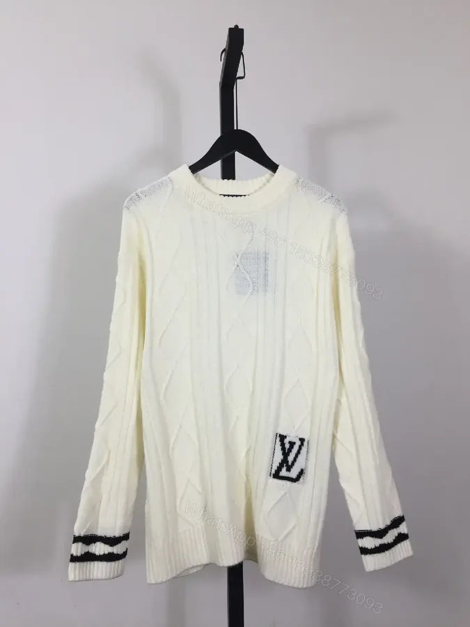 View 1 of Creamy Off-White Cable-Knit Crewneck Sweater with Striped Cuffs