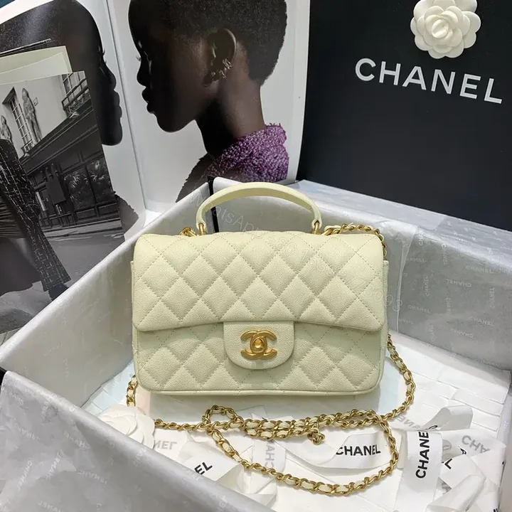 View 1 of Compact Quilted Handbag with Gold Chain Strap - Timeless Luxury