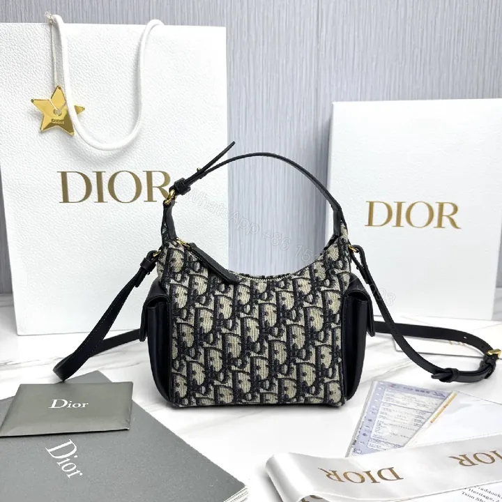 View 1 of Compact Monogram Canvas Bag with Leather Trim and Crossbody