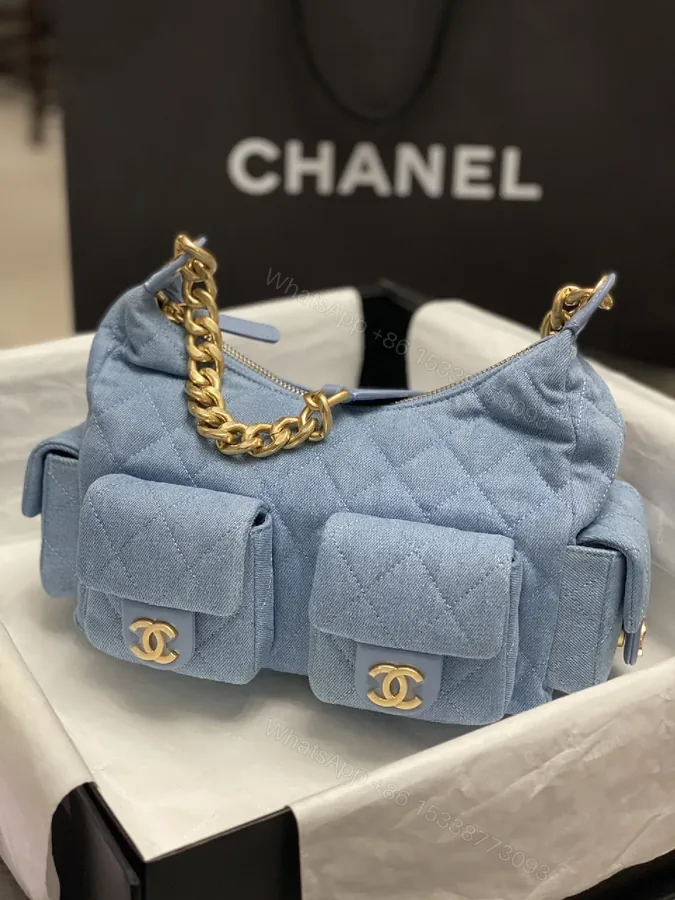 View 1 of Denim Quilted Mini Bag with Gold Chain Handle