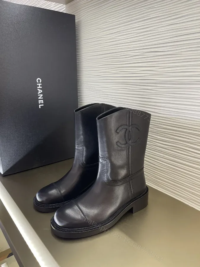 View 1 of Chic Black Leather Knee-High Boots with Logo Embellishment