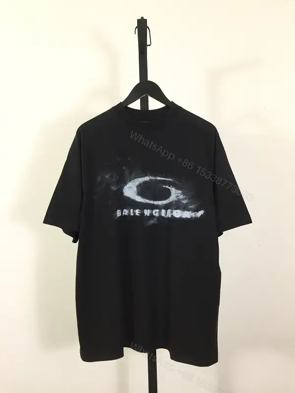 View 1 of Bold Graphic Tee with Distressed Logo: Luxe Streetwear Tee