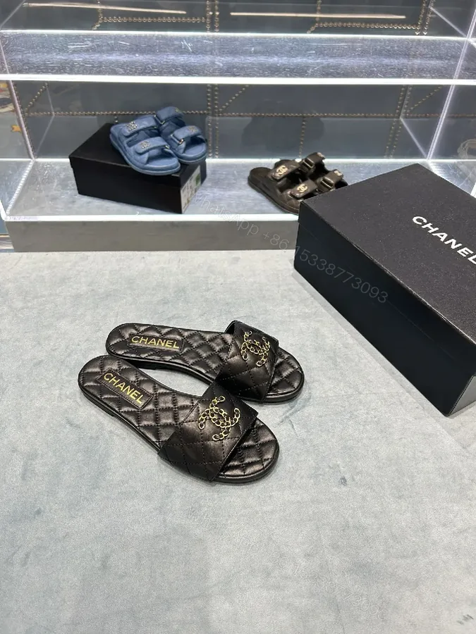 View 1 of Quilted Black Slides with Gold Emblem – Lux Slip-ons