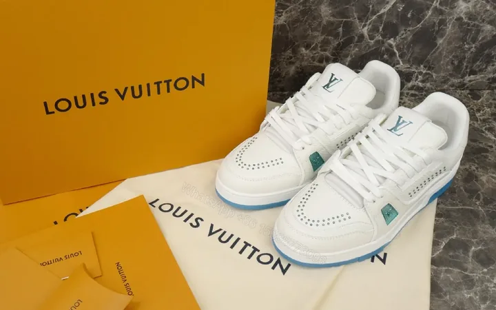View 1 of White Leather Luxury Sneakers with Subtle LV Accents
