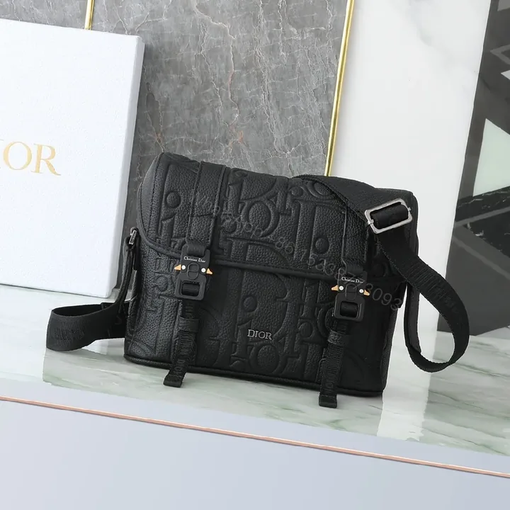 View 1 of Black Embossed Leather Messenger Bag with Luxe Hardware