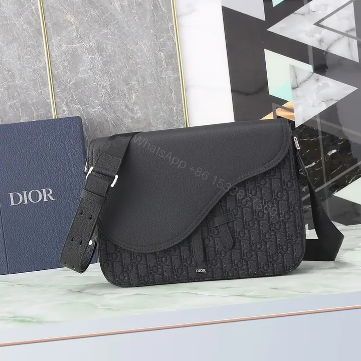 View 1 of Chic Black Monogram Crossbody with Textured Leather Flap