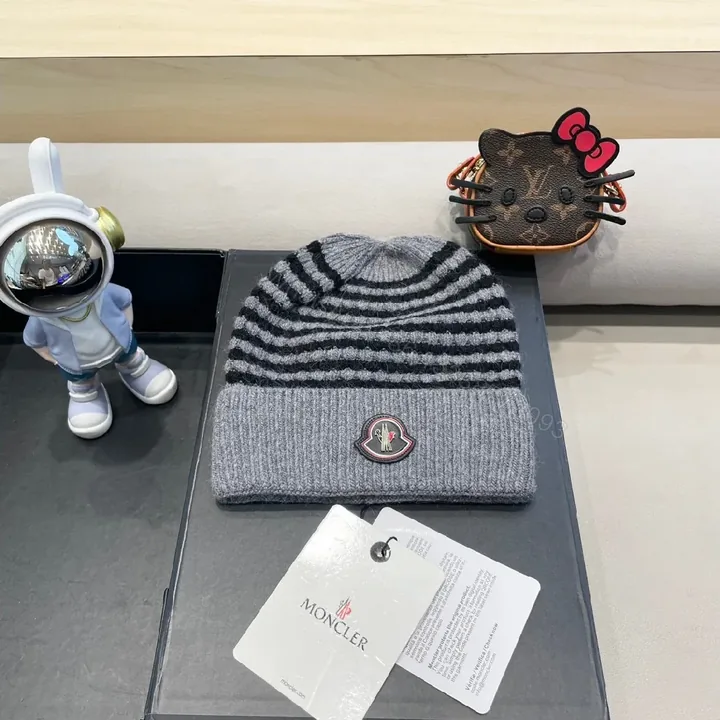 View 1 of Cozy Striped Knit Beanie with Moncler Badge - Luxe Warmth