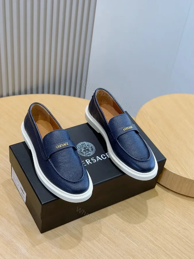 View 1 of Navy Leather Slip-On Loafers with Gold Branding