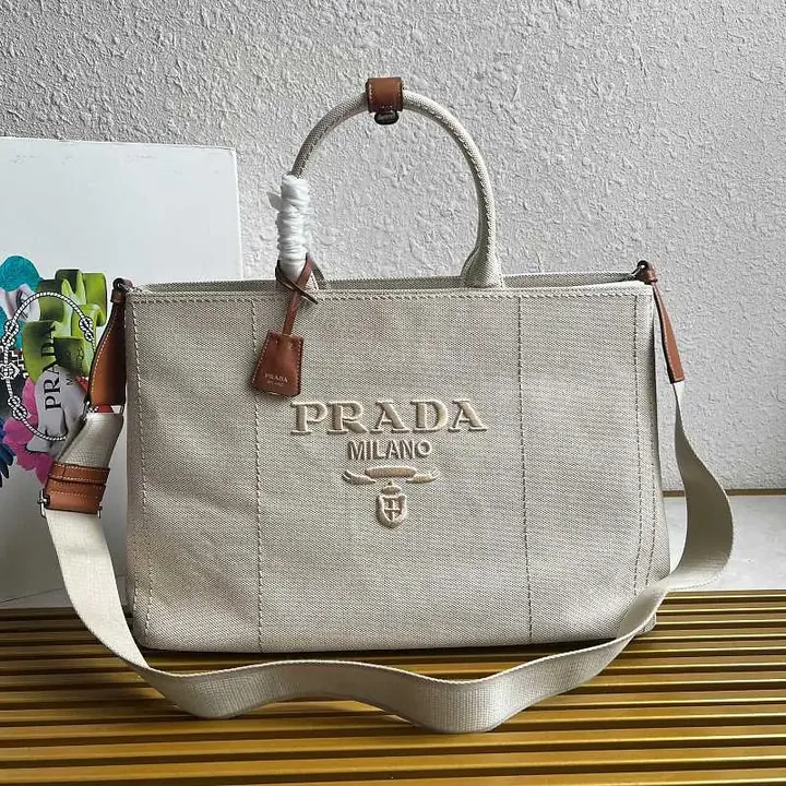 View 1 of Light Beige Canvas Tote Bag with Leather Accents and Structured Silhouette