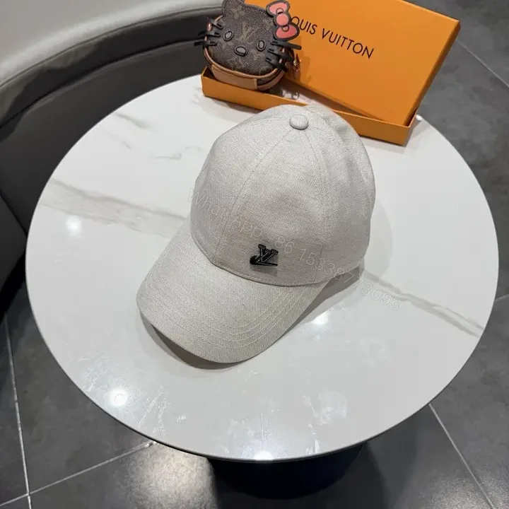 View 1 of Cozy Chic Cap: Subtle LV Logo, All-Season Cotton blend Cap