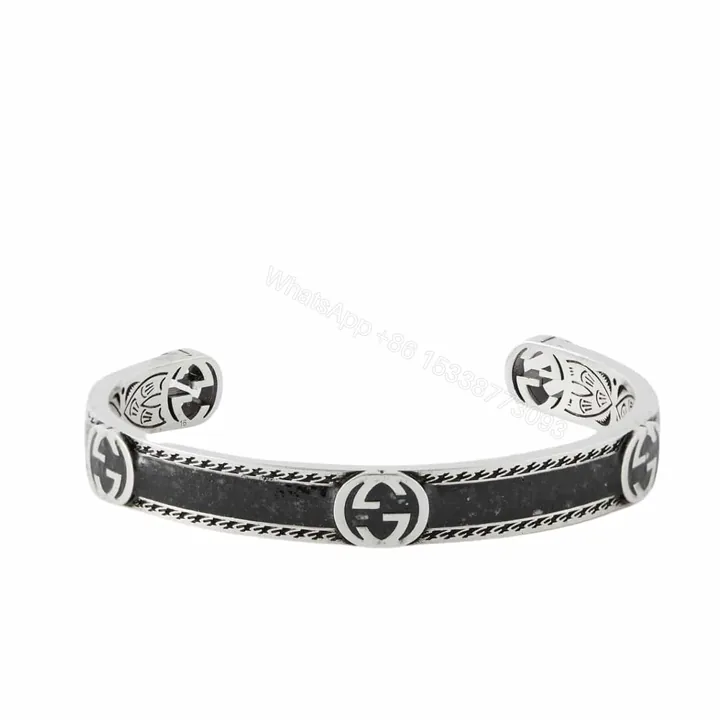 View 1 of GUCCI CUFF BRACELET INTERLOCKING GG STERLING SILVER BLACK ENAMEL