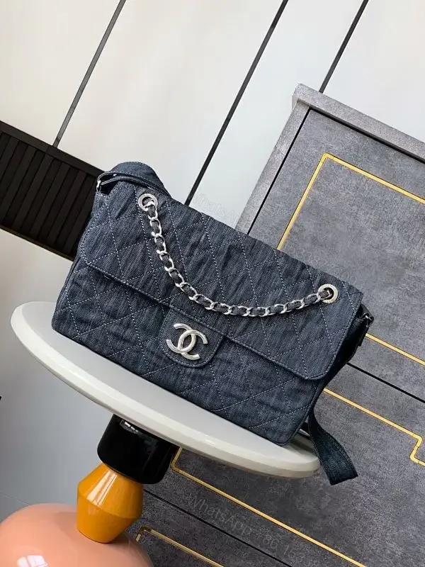 View 1 of Denim Quilted Flap Bag with Signature Chain Closure