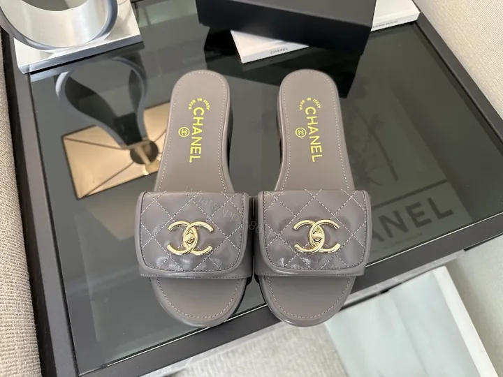 View 1 of Quilted Leather Slides with Gold Logo – Luxe Comfort
