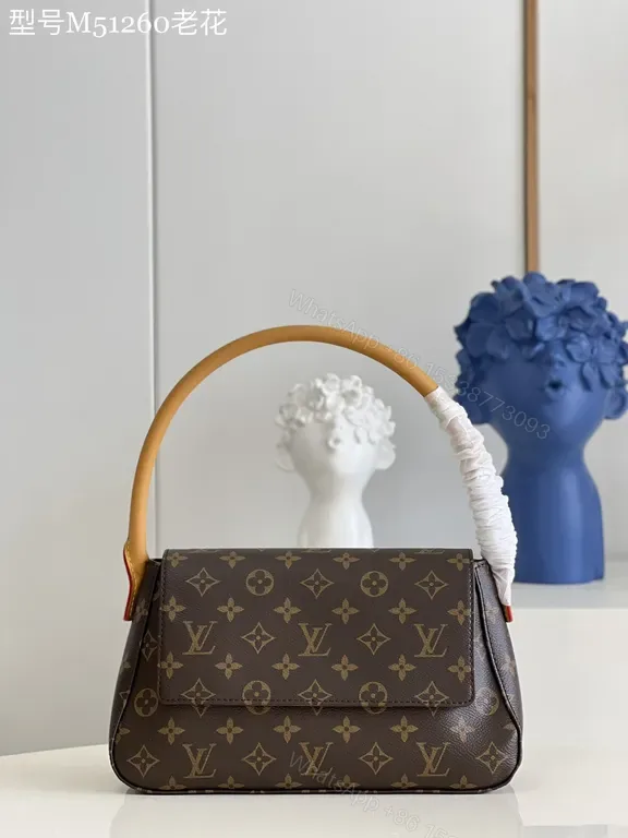 View 1 of Louis Vuitton Monogram Top-Handle Bag: Compact Luxury for Day to Night