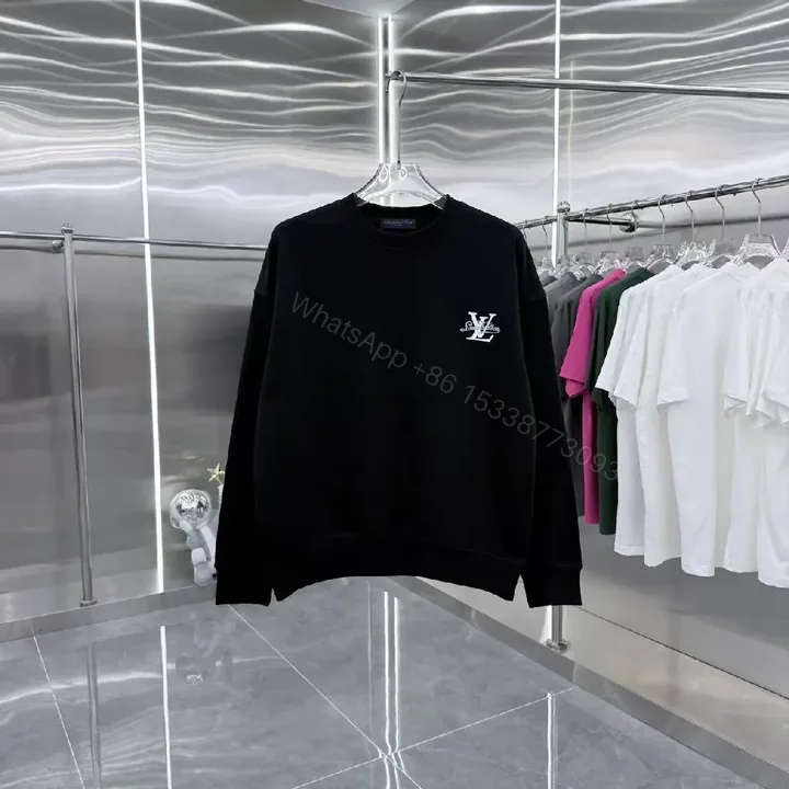 View 1 of Minimalist Black Crewneck with Subtle LV-Accent - Luxury Staple