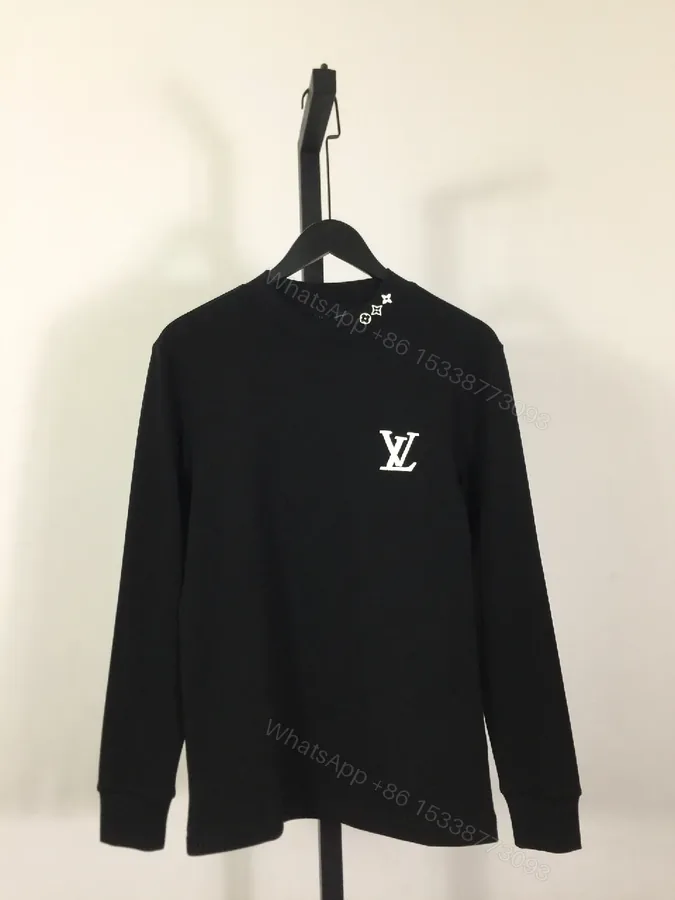 View 1 of Minimalist Black Sweatshirt with Subtle Monogram Accent