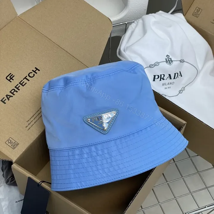 View 1 of Blue Prada Bucket Hat: Luxe Nylon, Sun-Protection, Packable
