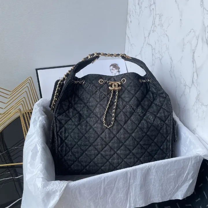 View 1 of Structured Quilted Luxury Bag with Gold Hardware