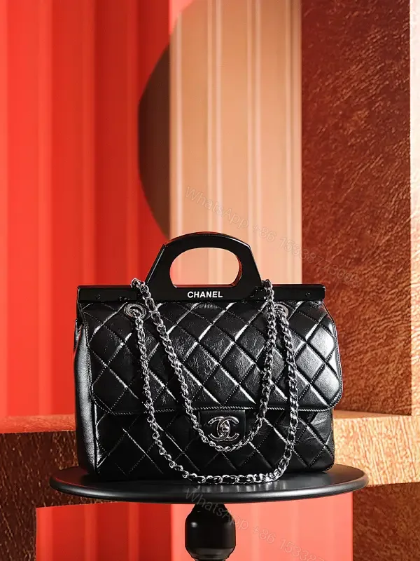 View 1 of Black Quilted Leather Handbag - Classic Chic, Compact Luxury