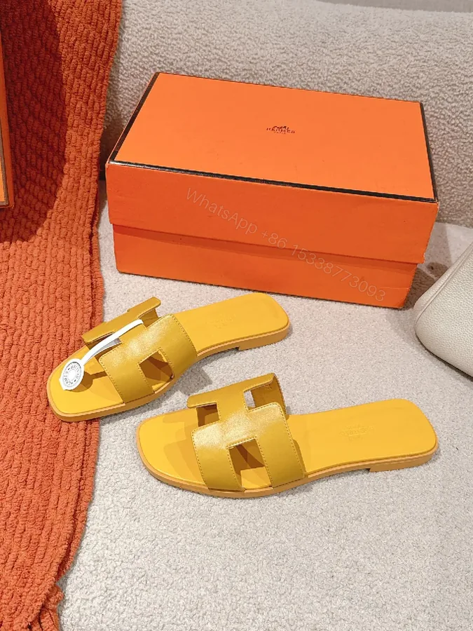 View 1 of Bright Yellow Leather Slip-On Sandals: Lightweight Luxury