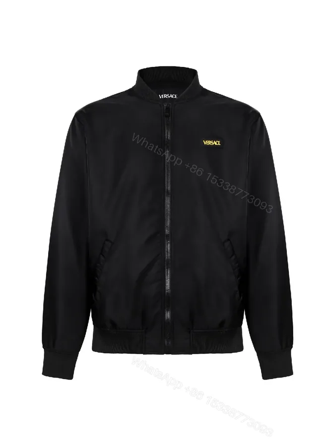 View 1 of Minimalist Black Bomber with Gold Accent: Modern Luxury Outerwear