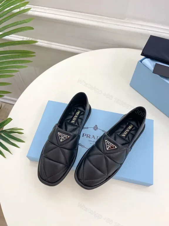 View 1 of Quilted Leather Slip-Ons with Prada Triangle - All-Day Comfort
