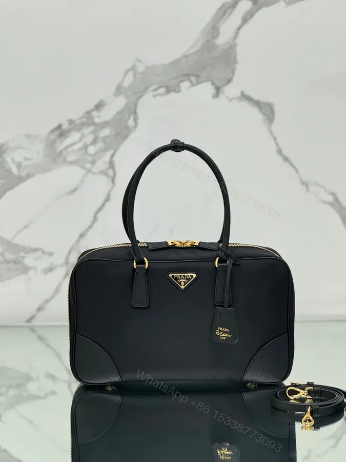 View 1 of LARGE TOP HANDLE BAG 35 IN BLACK NYLON AND CALFSKIN TRIM