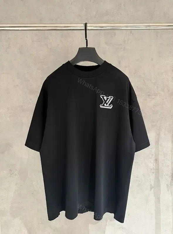 View 1 of Oversized Black Knit Tee, Luxury Crest Embroidery, Casual Comfort