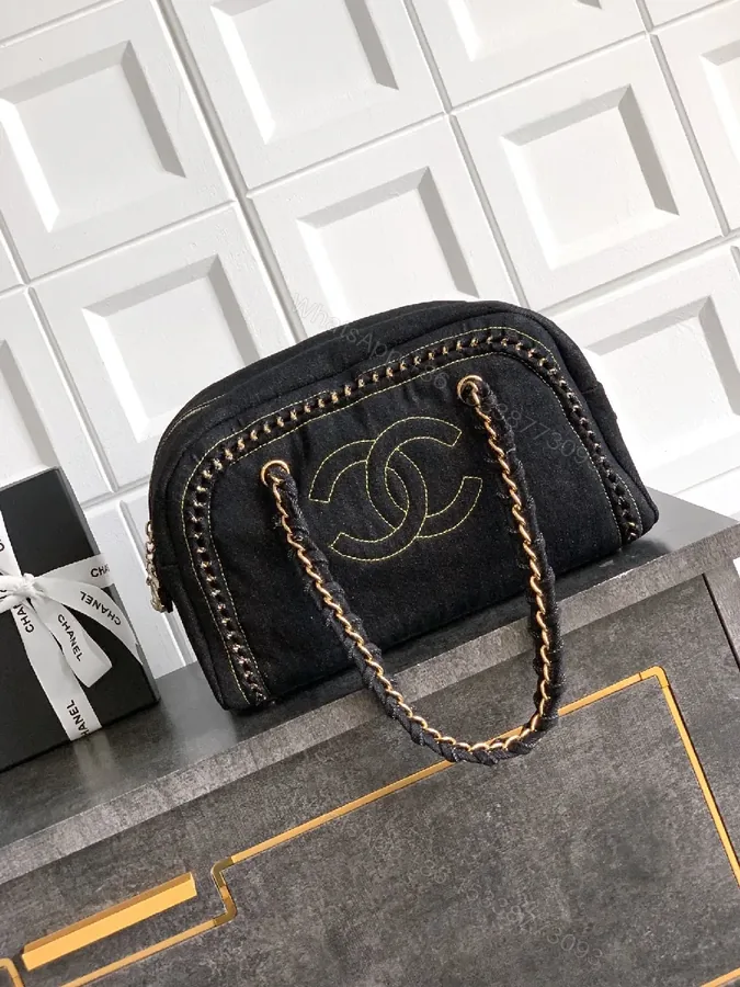 View 1 of Black Velvet Compact Handbag with Gold Stitching
