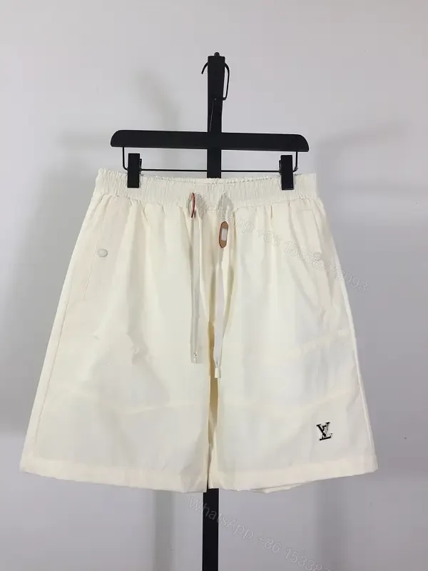 View 1 of Cream Canvas Shorts - Relaxed Style, Drawstring Waist, LV Logo