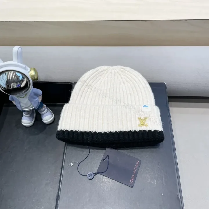 View 1 of Two-Tone Knit Beanie with Gold LV Emblem
