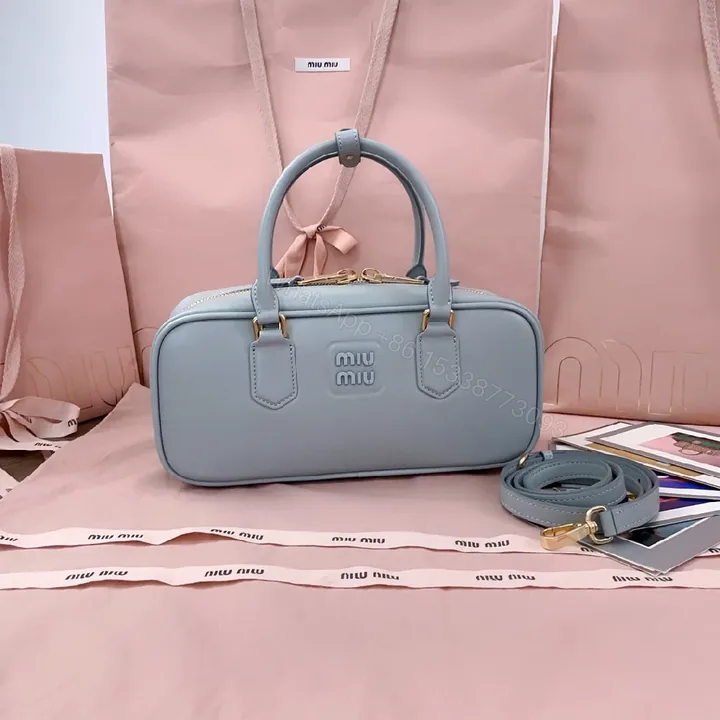 View 1 of Structured Dome Bag: Compact Luxury, Gold Accents, Versatile Style