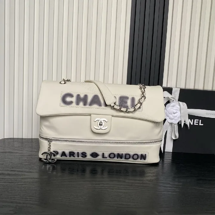 View 1 of White Leather Flap Bag: Minimalist Luxury, Structured Charm