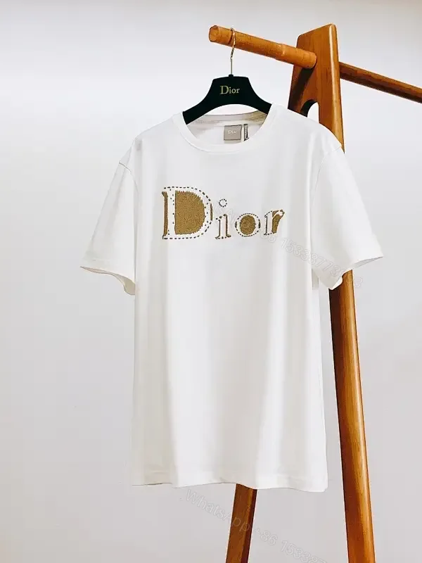 View 1 of White Cotton Tee + Subtle Logo Embellishment + Luxe Casual + Elevated Detail + T-Shirt