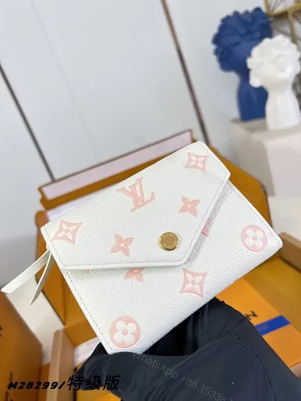 View 1 of Chic White Pebble Leather Wallet: Pink LV Accents, Compact Luxury