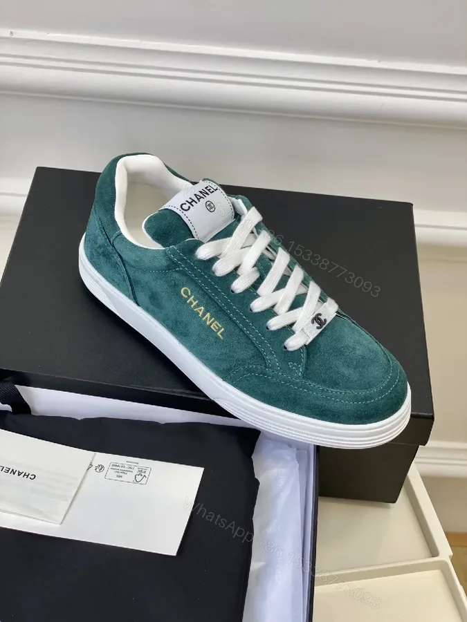 View 1 of Teal Suede Low-Top Sneakers with Signature Accents
